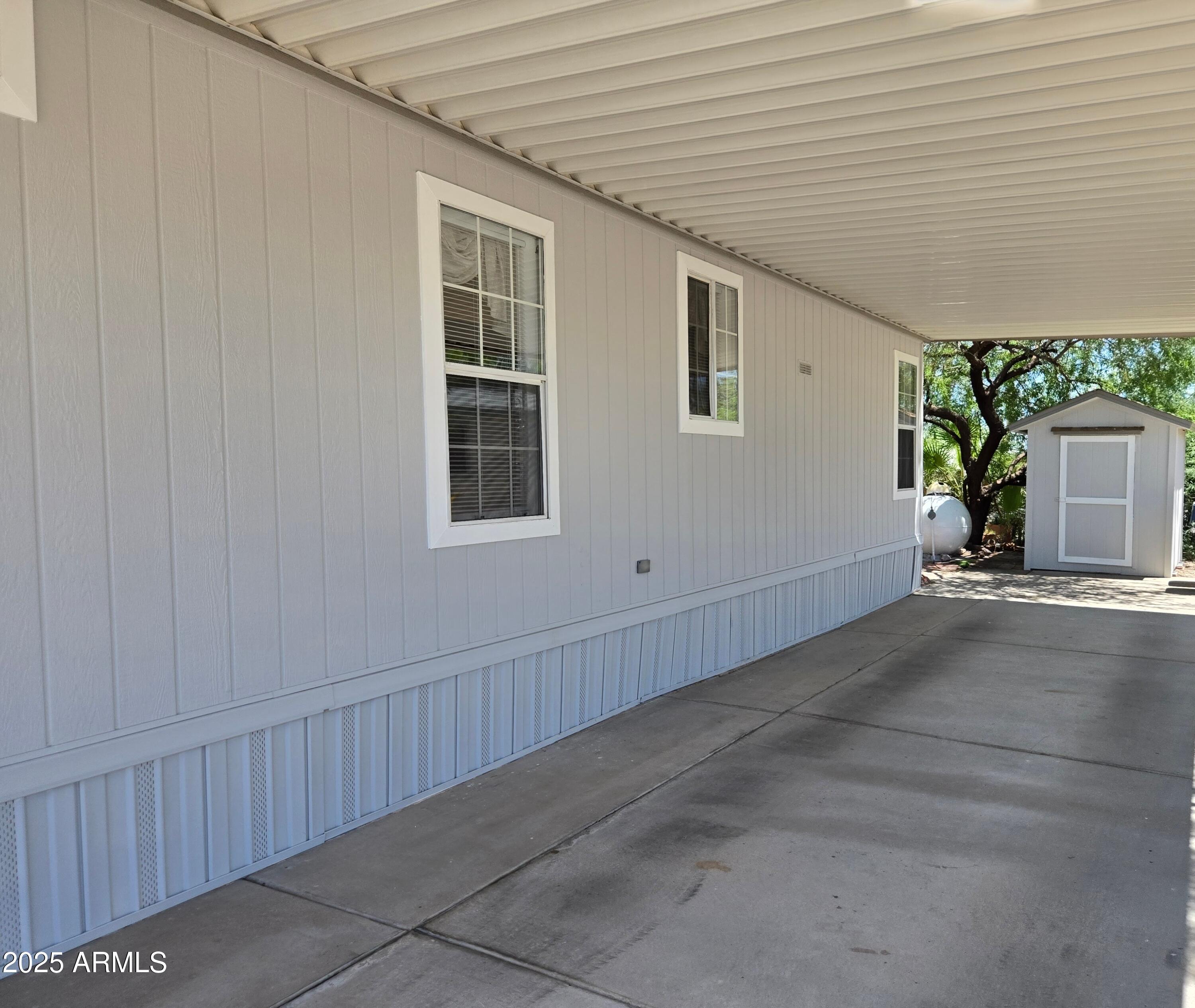 2000 South Apache Road, Unit 87 Buckeye, AZ 85326 - Photo 23 of 29 a view of a house with a garage