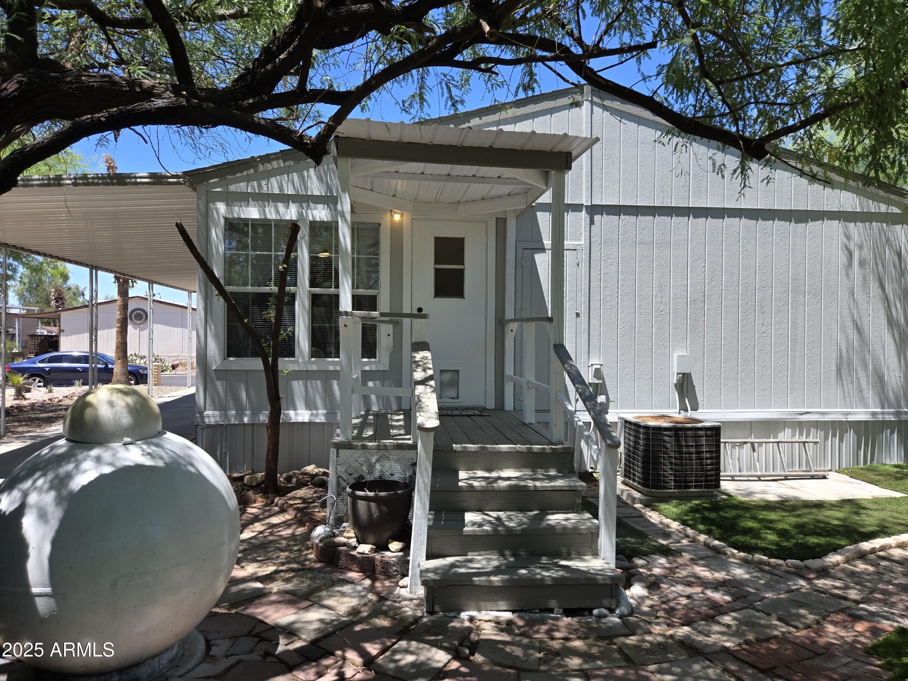 2000 South Apache Road, Unit 87 Buckeye, AZ 85326 - Photo 26 of 29 a view of a house with backyard and porch
