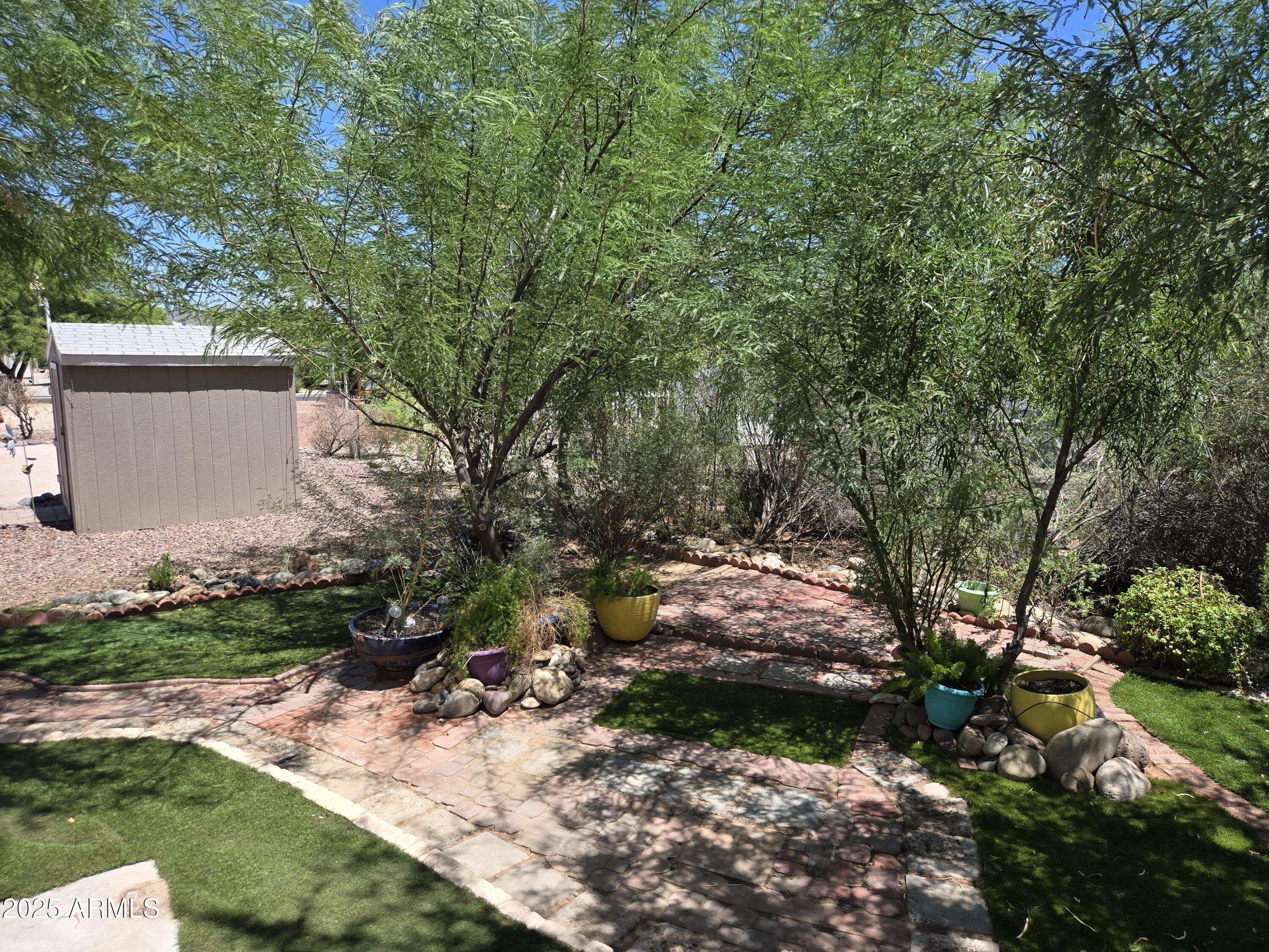 2000 South Apache Road, Unit 87 Buckeye, AZ 85326 - Photo 29 of 29 a backyard of a house with a yard and outdoor seating