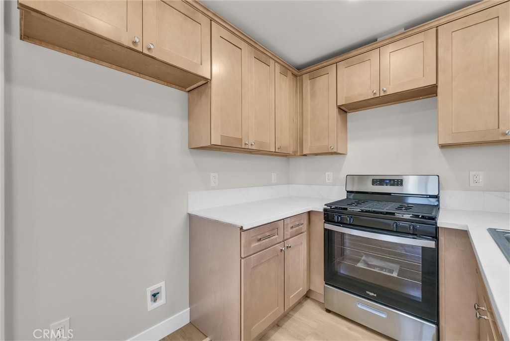 2264 Cogswell Road El Monte, CA 91732 - Photo 11 of 26 a kitchen with white cabinets and appliances
