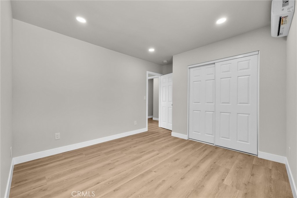 2264 Cogswell Road El Monte, CA 91732 - Photo 16 of 26 an empty room with wooden floor and closet