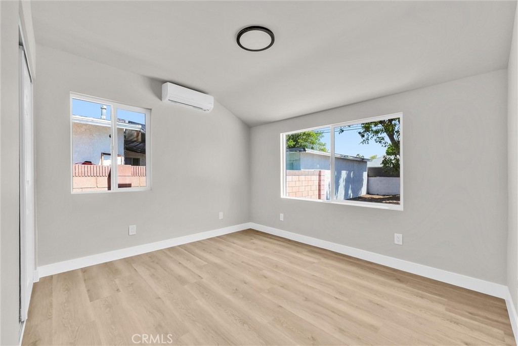 2264 Cogswell Road El Monte, CA 91732 - Photo 18 of 26 a view of an empty room with wooden floor and a window
