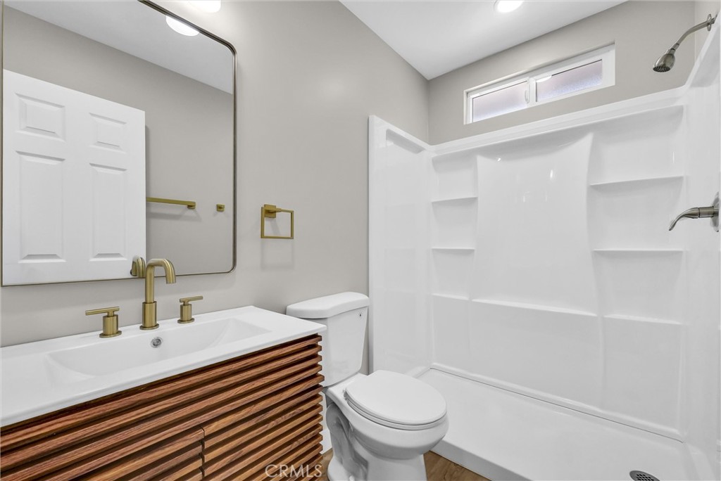 2264 Cogswell Road El Monte, CA 91732 - Photo 20 of 26 a bathroom with a sink toilet vanity and tub