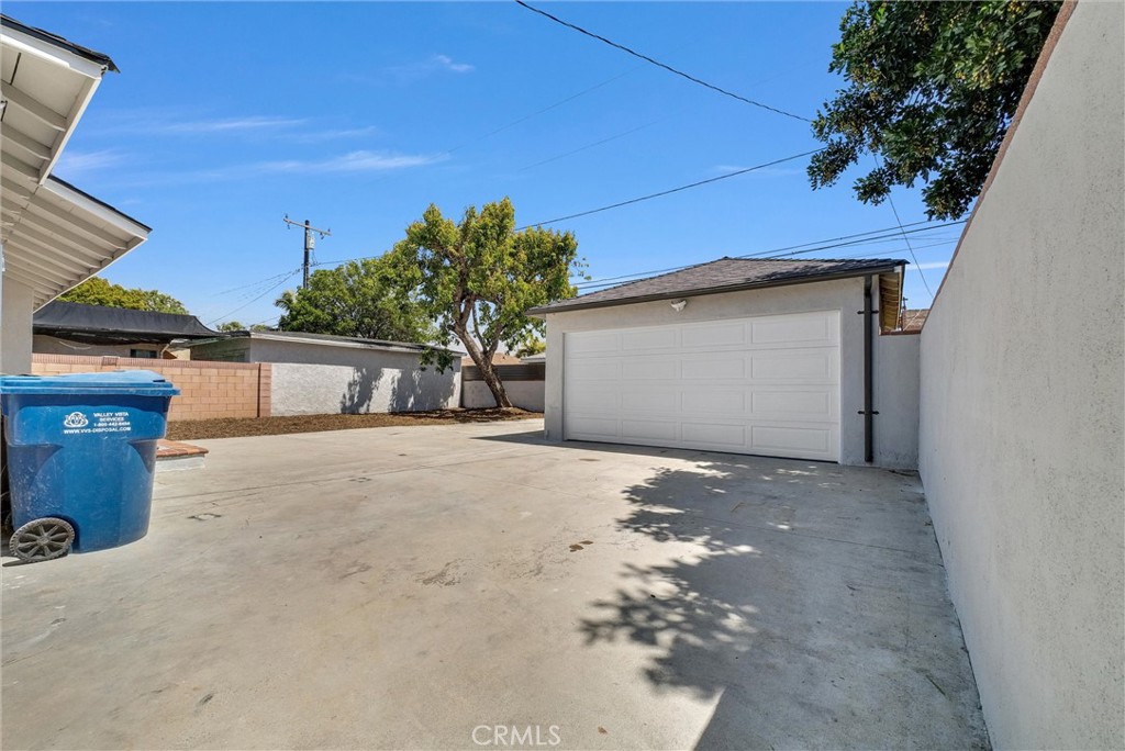 2264 Cogswell Road El Monte, CA 91732 - Photo 23 of 26 a view of a house with a yard and garage