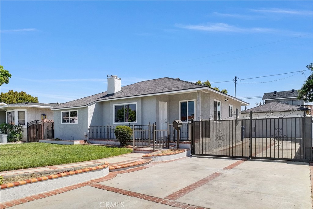2264 Cogswell Road El Monte, CA 91732 - Photo 3 of 26 a front view of a house with a garden