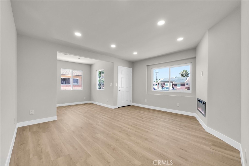 2264 Cogswell Road El Monte, CA 91732 - Photo 7 of 26 wooden floor in an empty room with a window