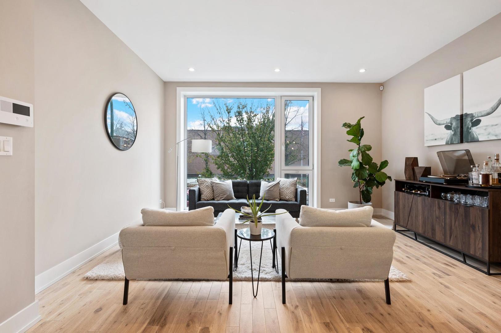 832 West Cullerton Street, Unit 1W Chicago, IL 60608 - Photo 2 of 14 a living room with furniture and a window