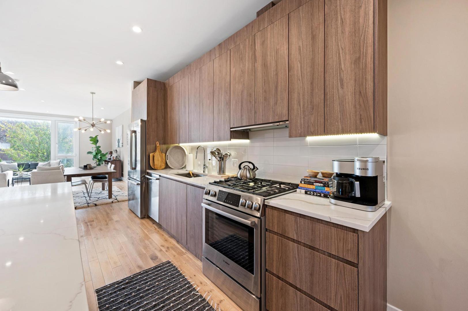 832 West Cullerton Street, Unit 1W Chicago, IL 60608 - Photo 6 of 14 a kitchen with a stove and a white refrigerator