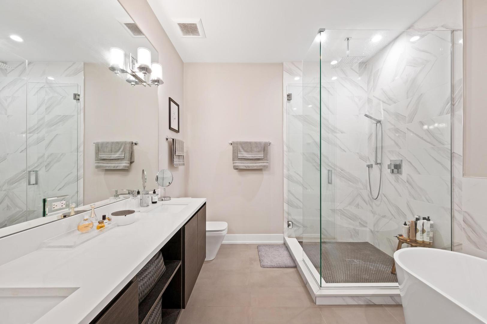 832 West Cullerton Street, Unit 1W Chicago, IL 60608 - Photo 7 of 14 a bathroom with a tub sink shower and mirror
