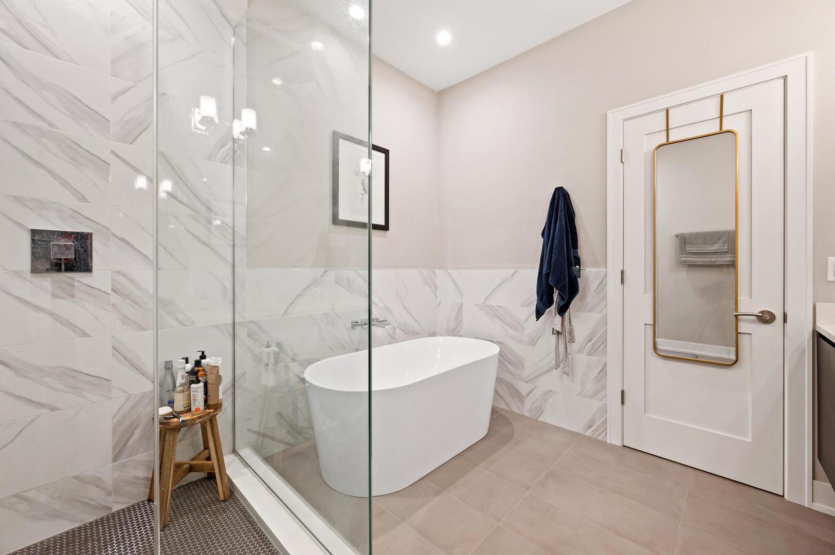 832 West Cullerton Street, Unit 1W Chicago, IL 60608 - Photo 8 of 14 a bathroom with a bathtub and a shower