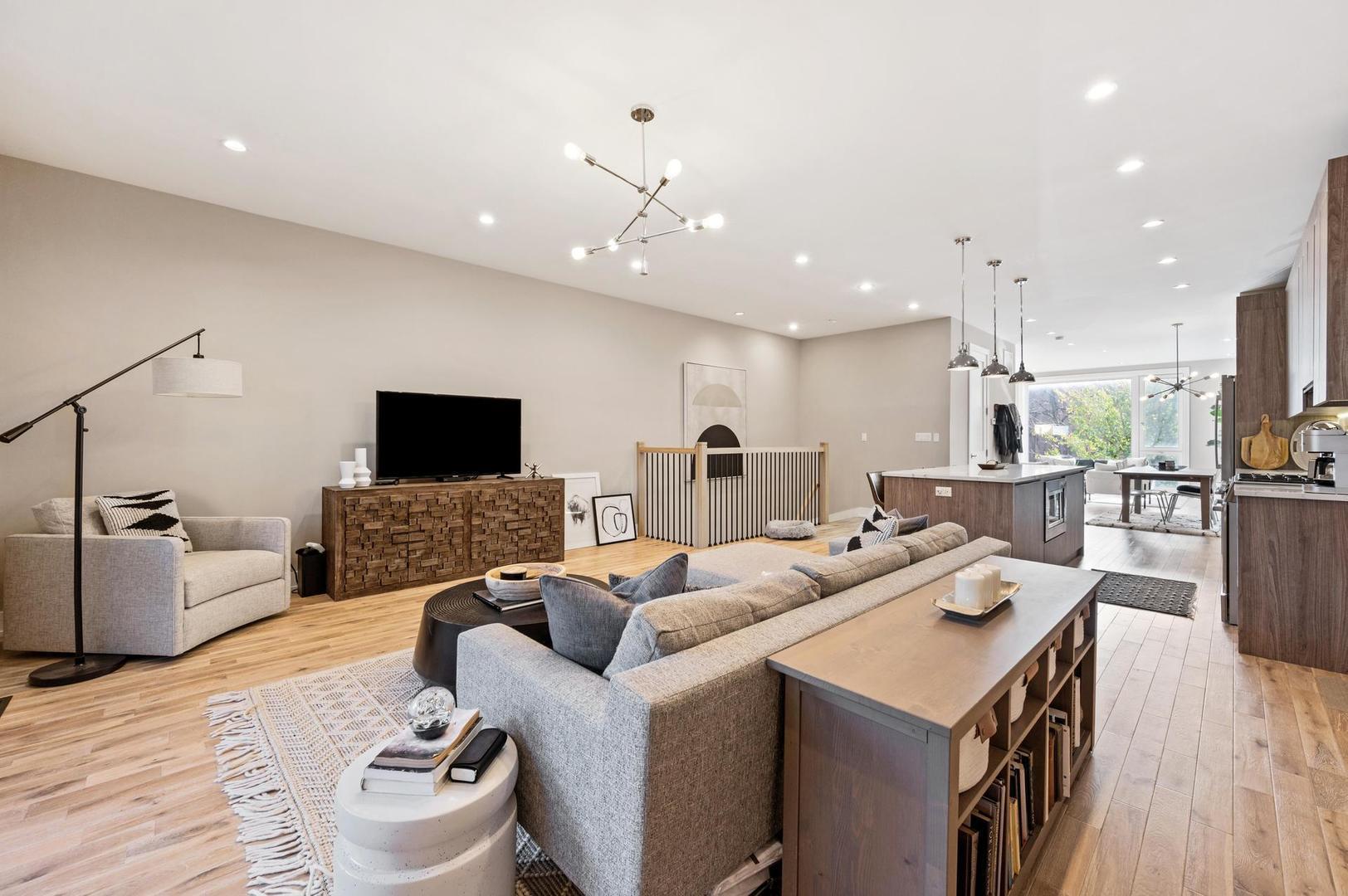 832 West Cullerton Street, Unit 1W Chicago, IL 60608 - Photo 9 of 14 a living room with furniture and a flat screen tv