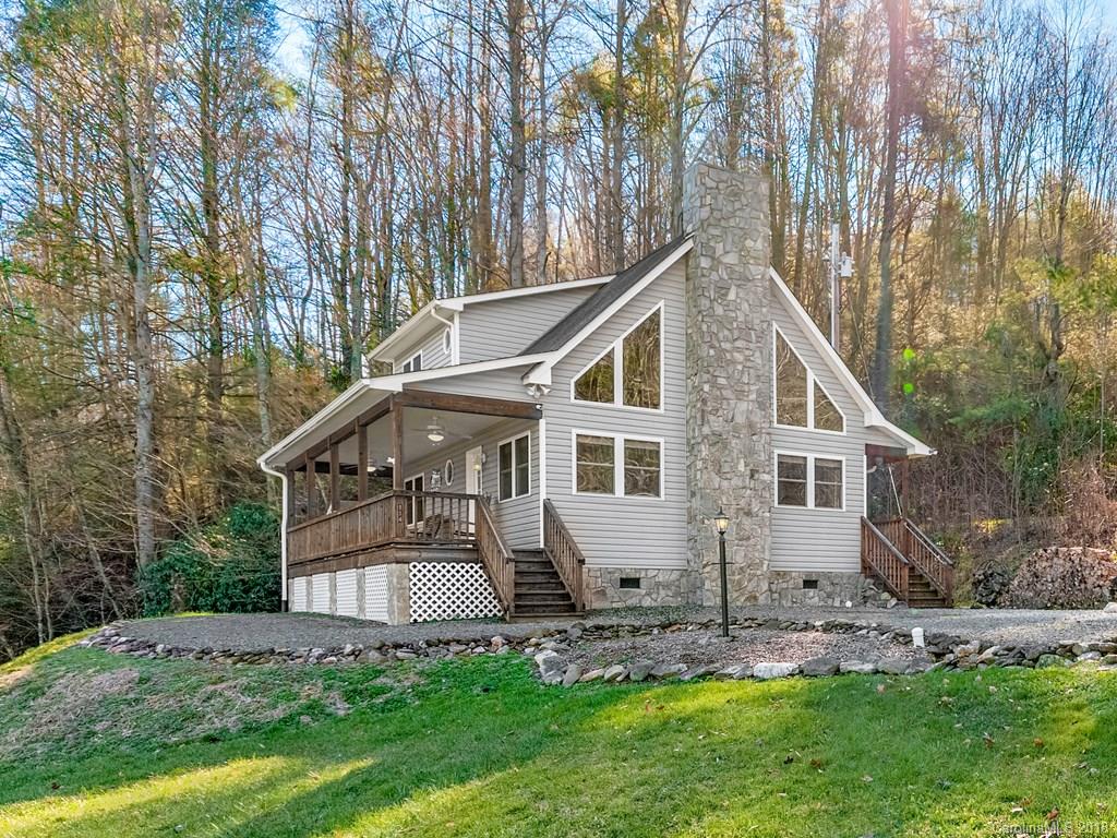 114 Turkey Creek Road Clyde, NC 28721 - Photo 1 of 12 a front view of a house with a yard and trees