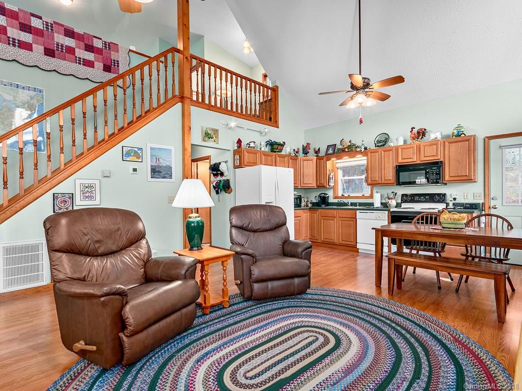114 Turkey Creek Road Clyde, NC 28721 - Photo 6 of 12 a living room with furniture and a kitchen view