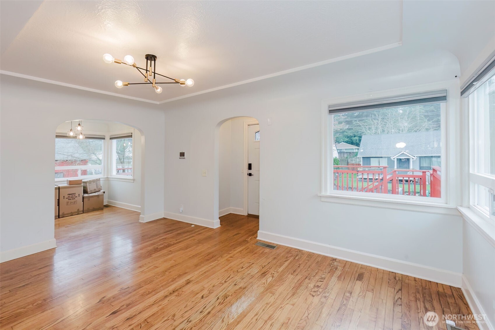 1908 Snyder Avenue Bremerton, WA 98312 - Photo 14 of 35 a view of an empty room with a window and wooden floor