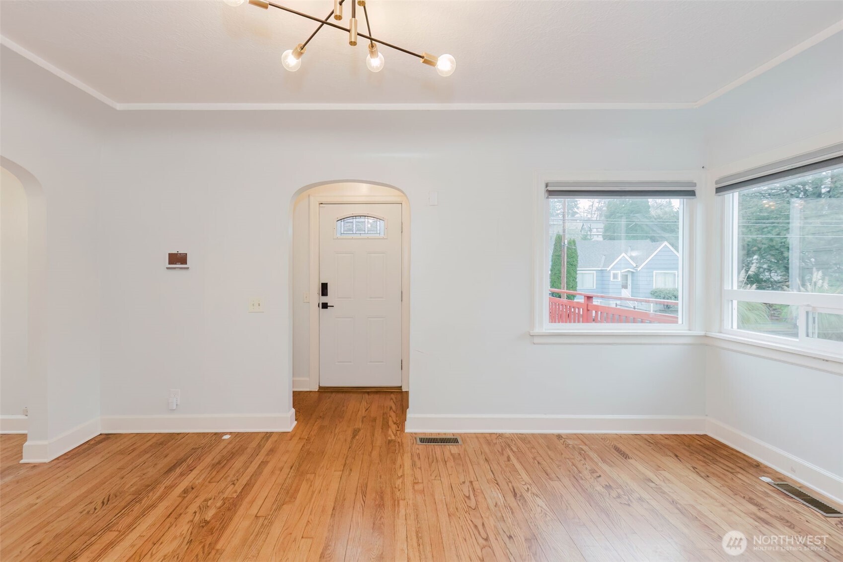 1908 Snyder Avenue Bremerton, WA 98312 - Photo 8 of 35 an empty room with wooden floor and windows