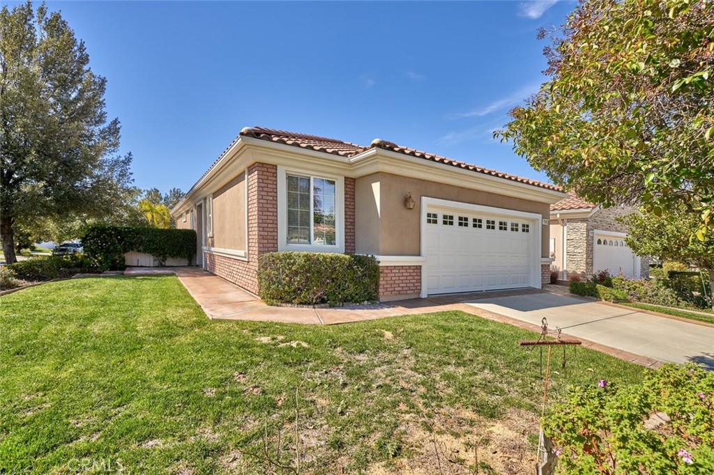 1143 Saguara Road Beaumont, CA 92223 - Photo 11 of 66 a front view of a house with a yard
