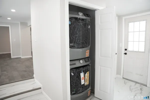 a view of hallway with washer and dryer