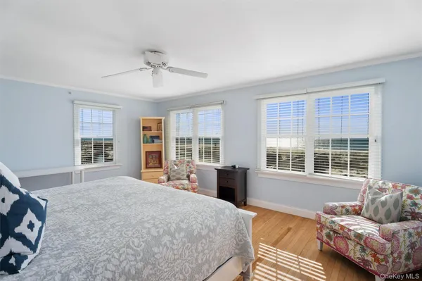 a bedroom with a bed dresser and a window