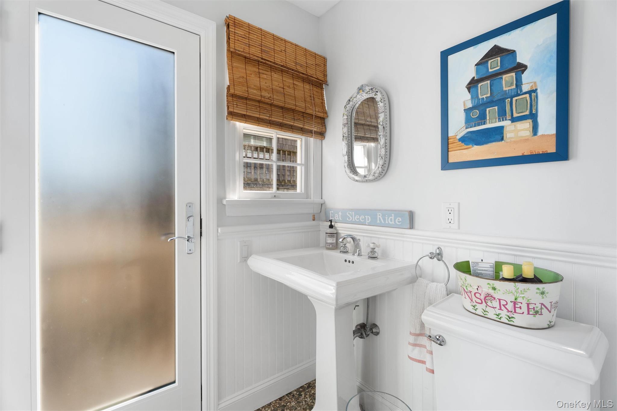 891 Dune Road West Hampton Dunes, NY 11978 - Photo 16 of 34 a bathroom with a sink and a mirror