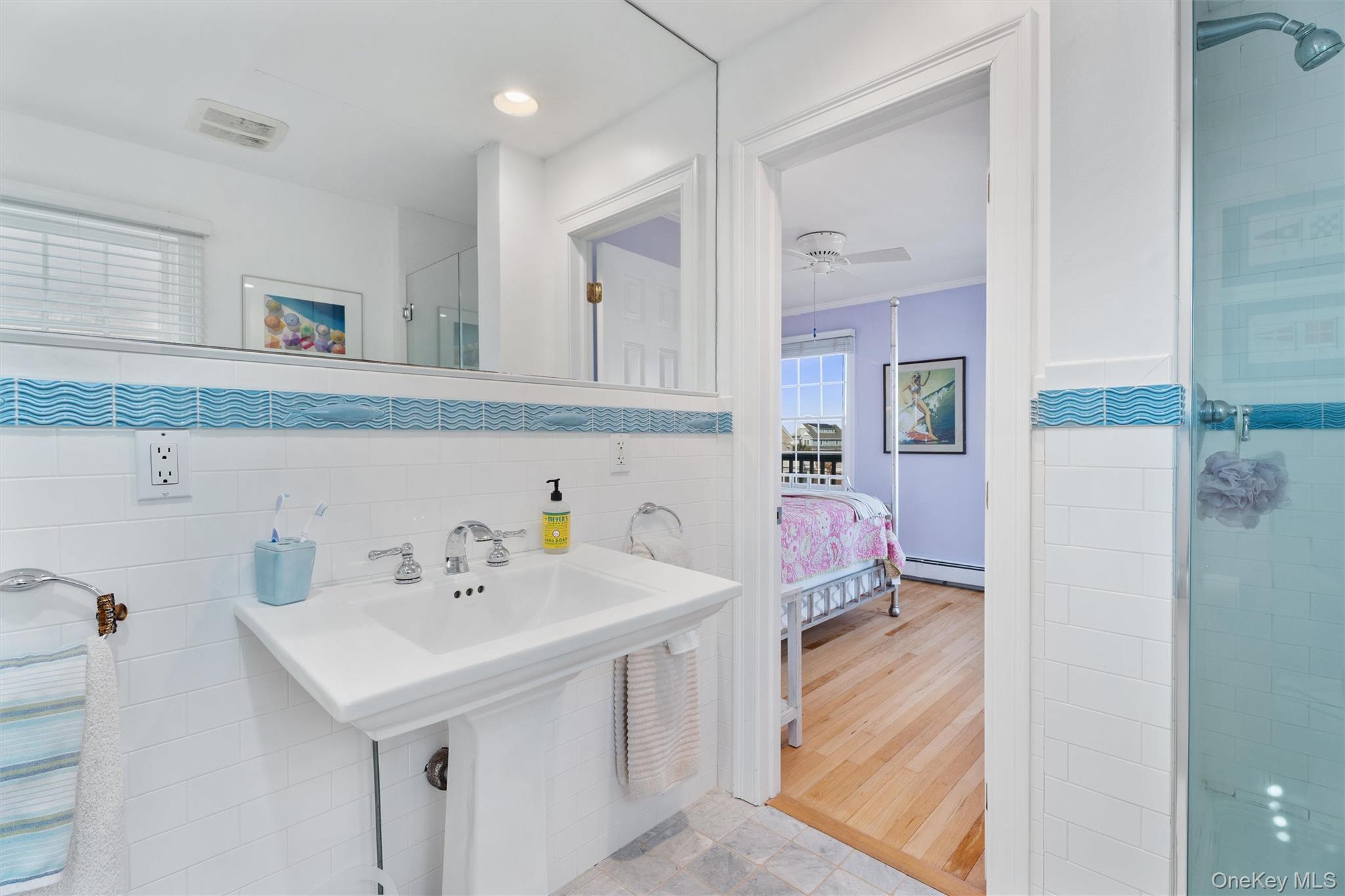 891 Dune Road West Hampton Dunes, NY 11978 - Photo 18 of 34 a bathroom with a sink and a mirror