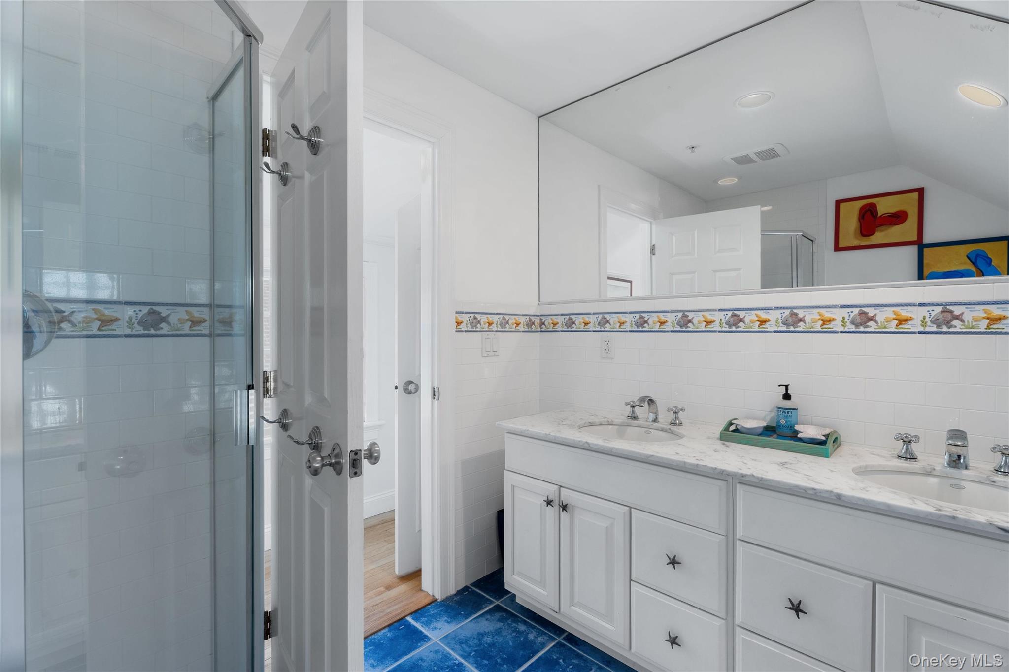 891 Dune Road West Hampton Dunes, NY 11978 - Photo 21 of 34 a bathroom with a granite countertop sink mirror and shower