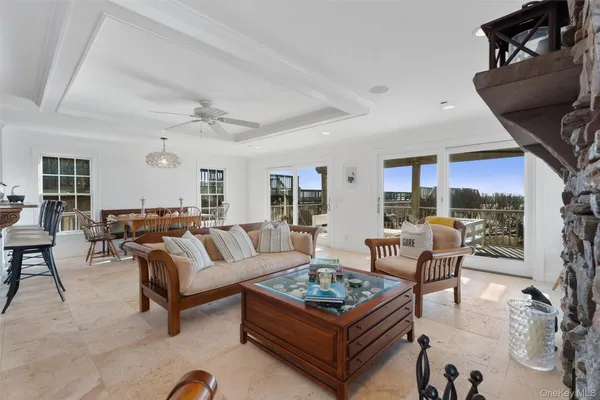 a living room with furniture a rug and a fireplace