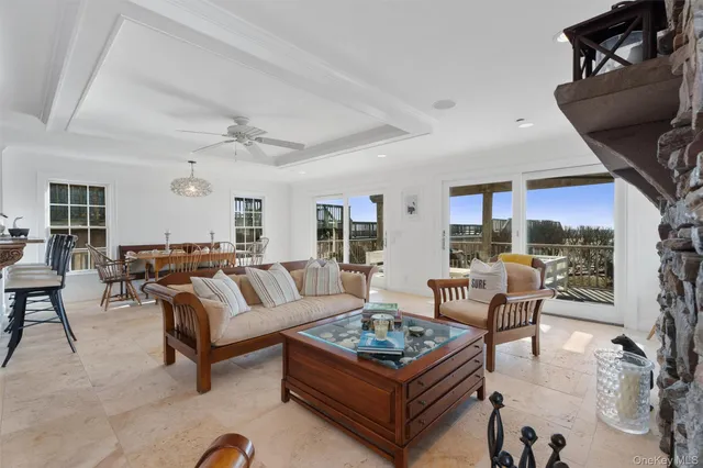 a living room with furniture a rug and a fireplace