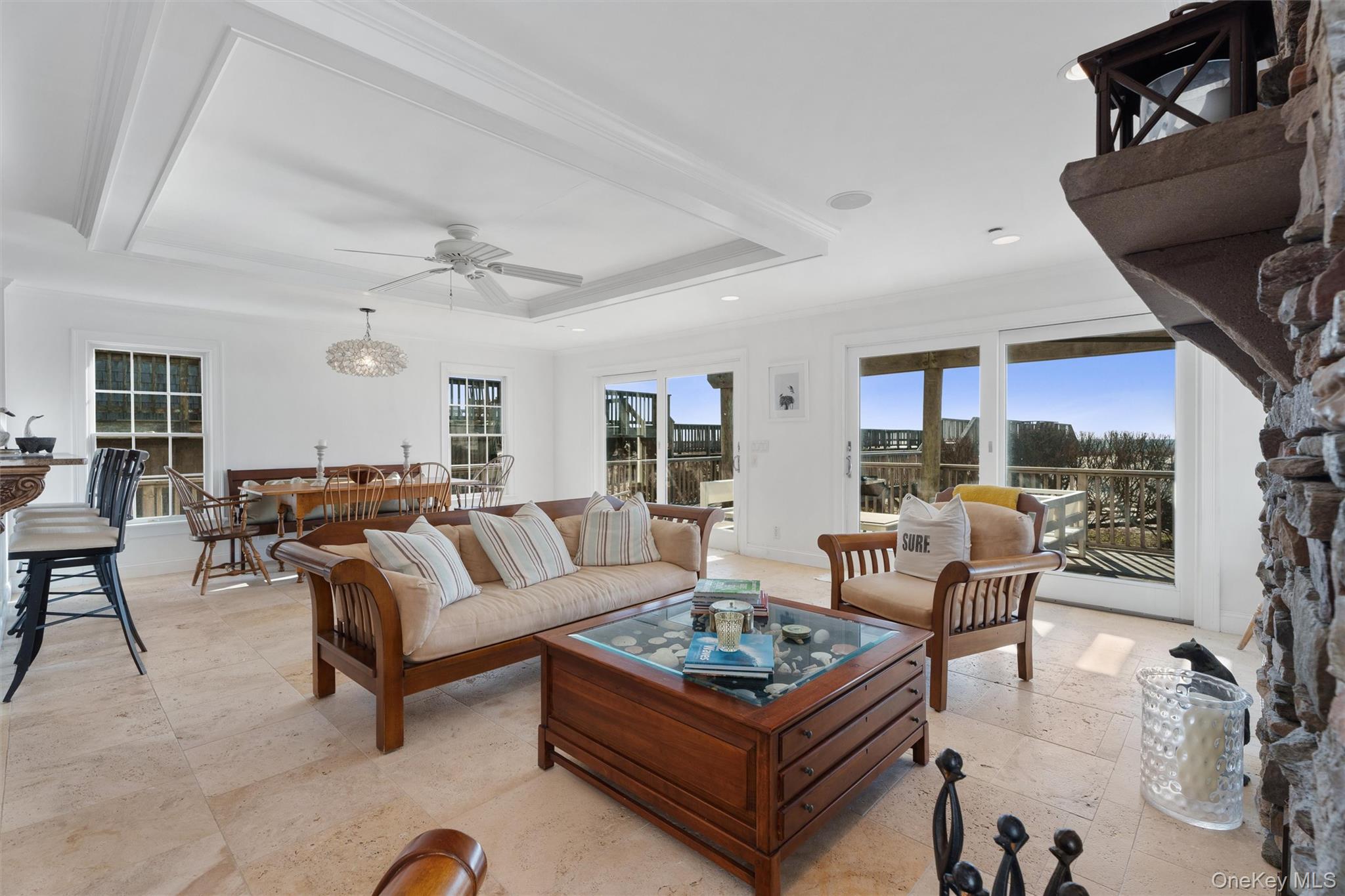 891 Dune Road West Hampton Dunes, NY 11978 - Photo 4 of 34 a living room with furniture a rug and a fireplace