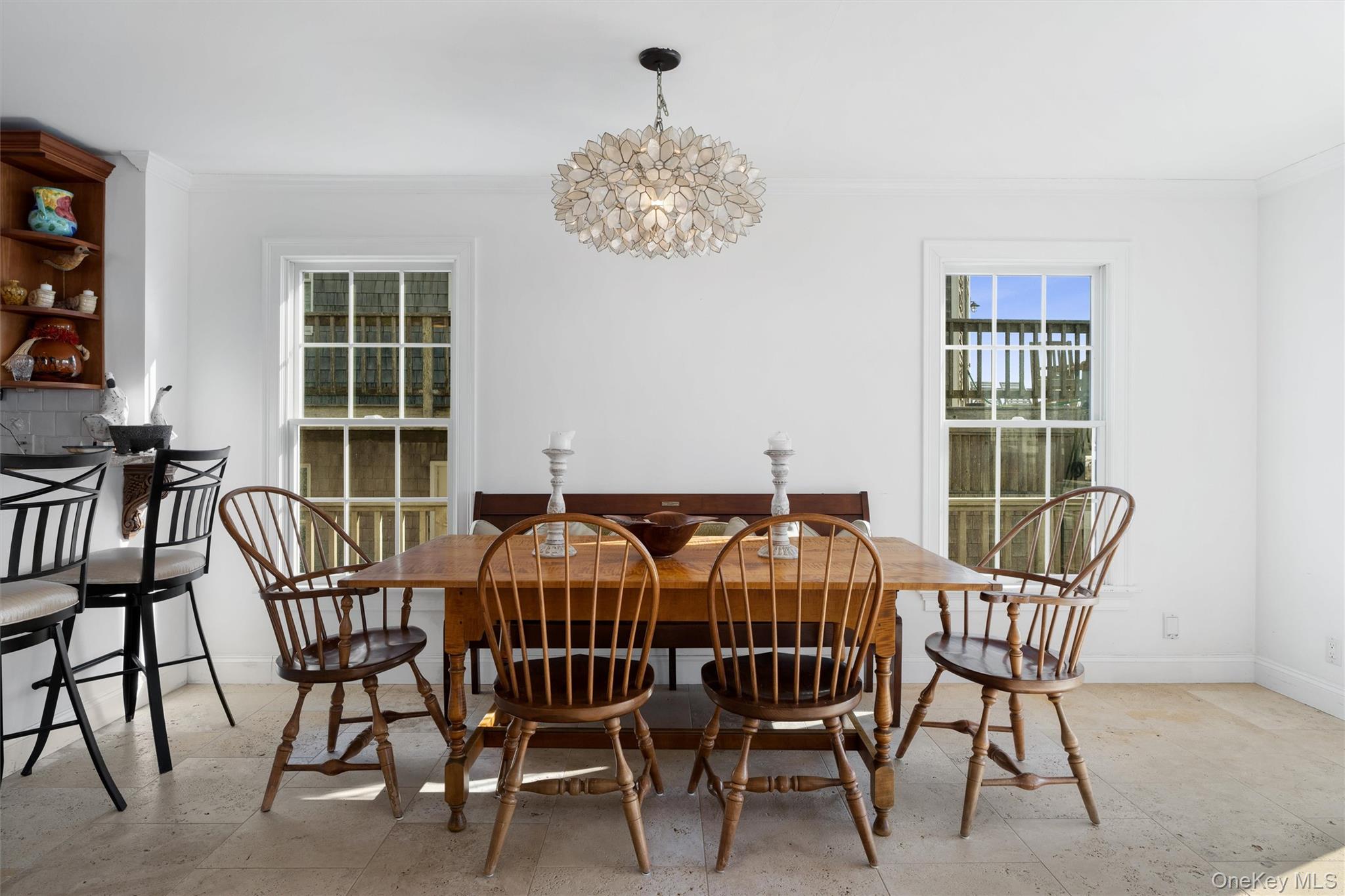 891 Dune Road West Hampton Dunes, NY 11978 - Photo 8 of 34 a view of a dining room with furniture window and outside view