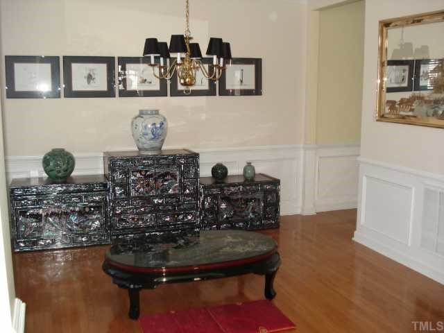 116 Beckford Road Cary, NC 27518 - Photo 3 of 12 Popular Transition From Formal Dining Room to Kitchen Area. Enhanced with Trim Molding and Beautiful Hardwood Floors! Dining Room
