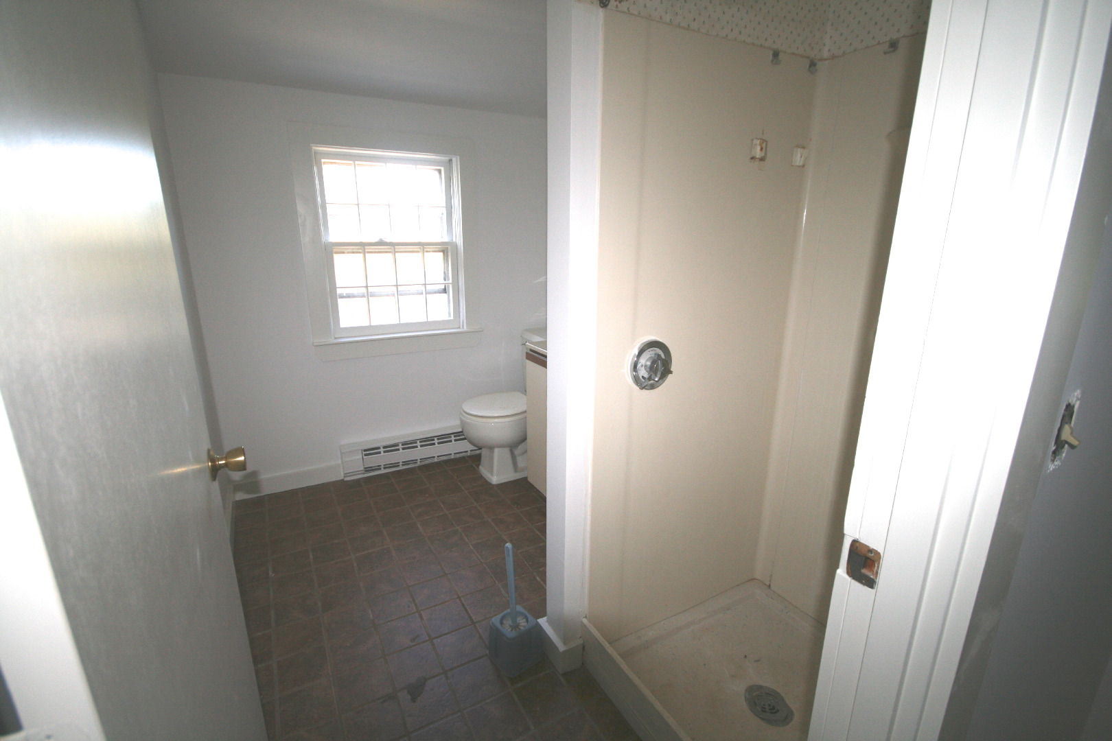 45 Fairgrounds Road Nantucket, MA 02554 - Photo 8 of 9 a bathroom with a granite countertop shower and a toilet