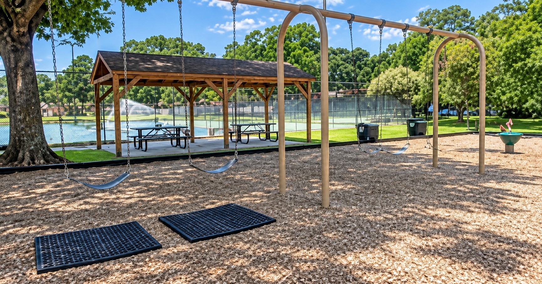 17523 Spicewood Springs Lane Spring, TX 77379 - Photo 29 of 42 Shaded picnic and gathering area surrounded by mature trees offers another inviting spot to sit, socialize, and enjoy the community’s outdoor amenities.