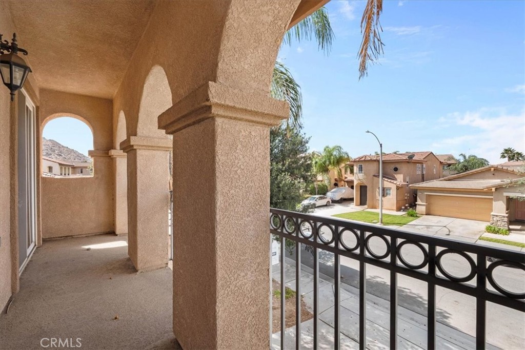 1474 Albillo Loop Perris, CA 92571 - Photo 24 of 35 a view of a balcony with furniture