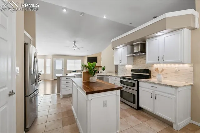 a view of a workspace with furniture