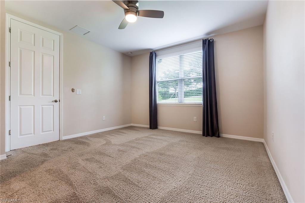 14533 Edgewater Circle Naples, FL 34114 - Photo 14 of 24 a view of an empty room with a window