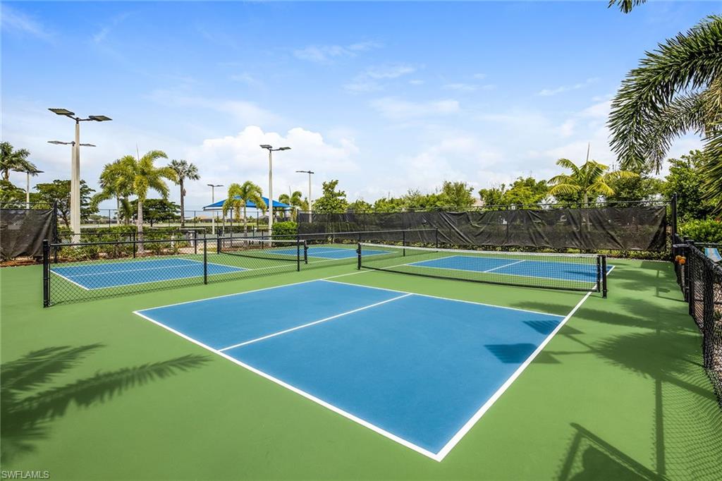 14533 Edgewater Circle Naples, FL 34114 - Photo 23 of 24 a view of a tennis court