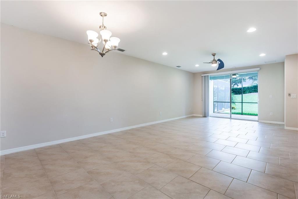 14533 Edgewater Circle Naples, FL 34114 - Photo 3 of 24 a view of an empty room with a window