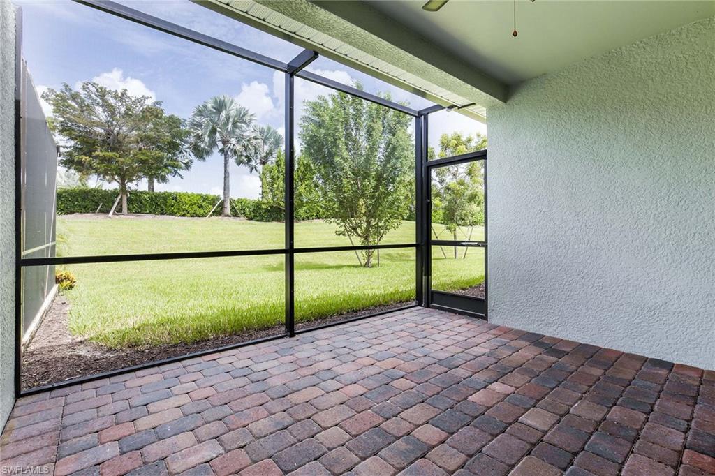 14533 Edgewater Circle Naples, FL 34114 - Photo 5 of 24 a view of porch with a yard