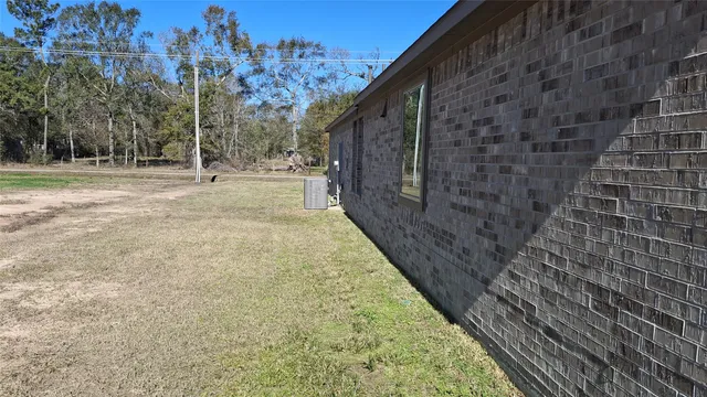 a view of pathway with yard