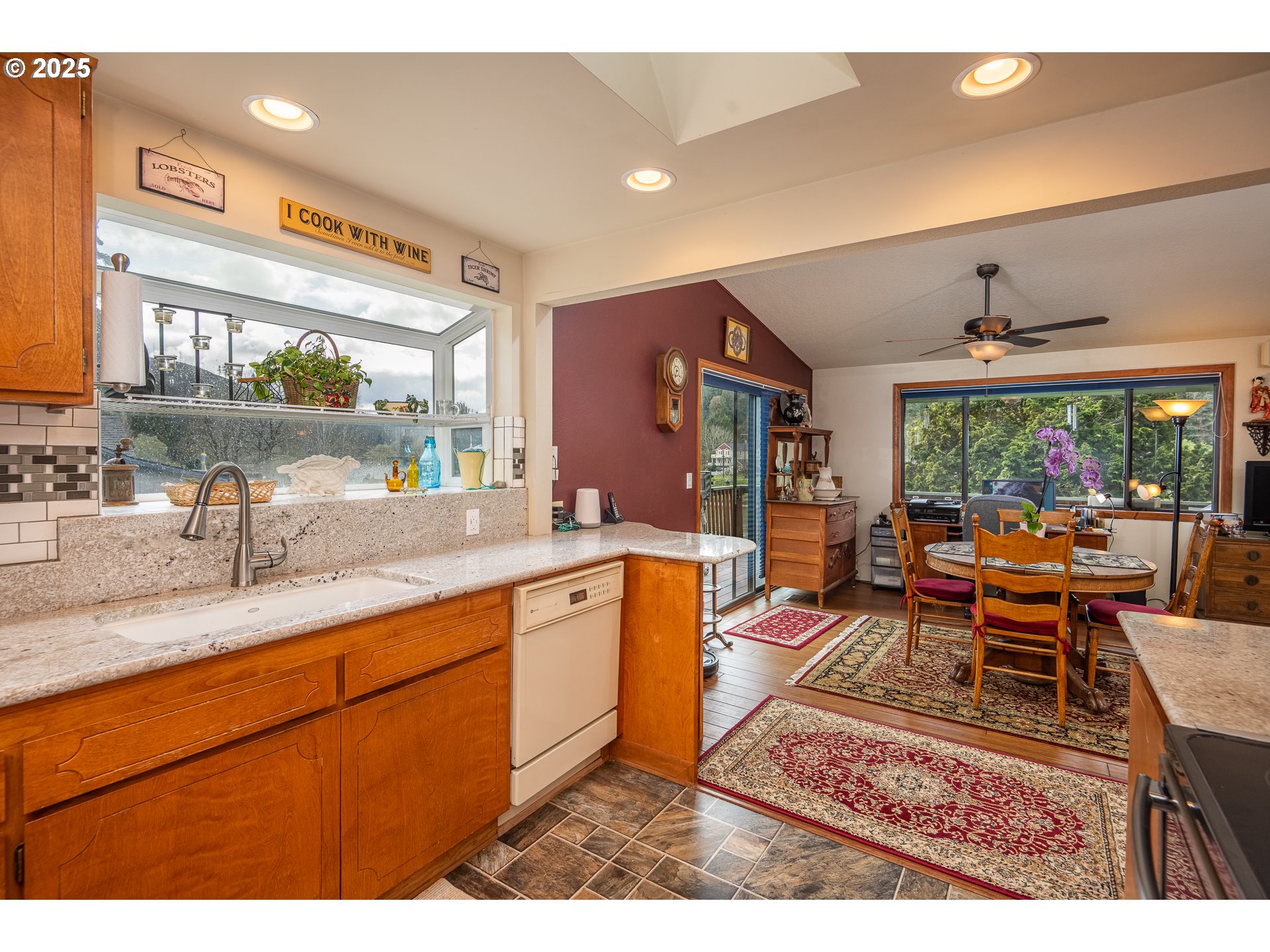 10927 East Mapleton Road Mapleton, OR 97453 - Photo 33 of 47 a living room with dining room and wooden floor