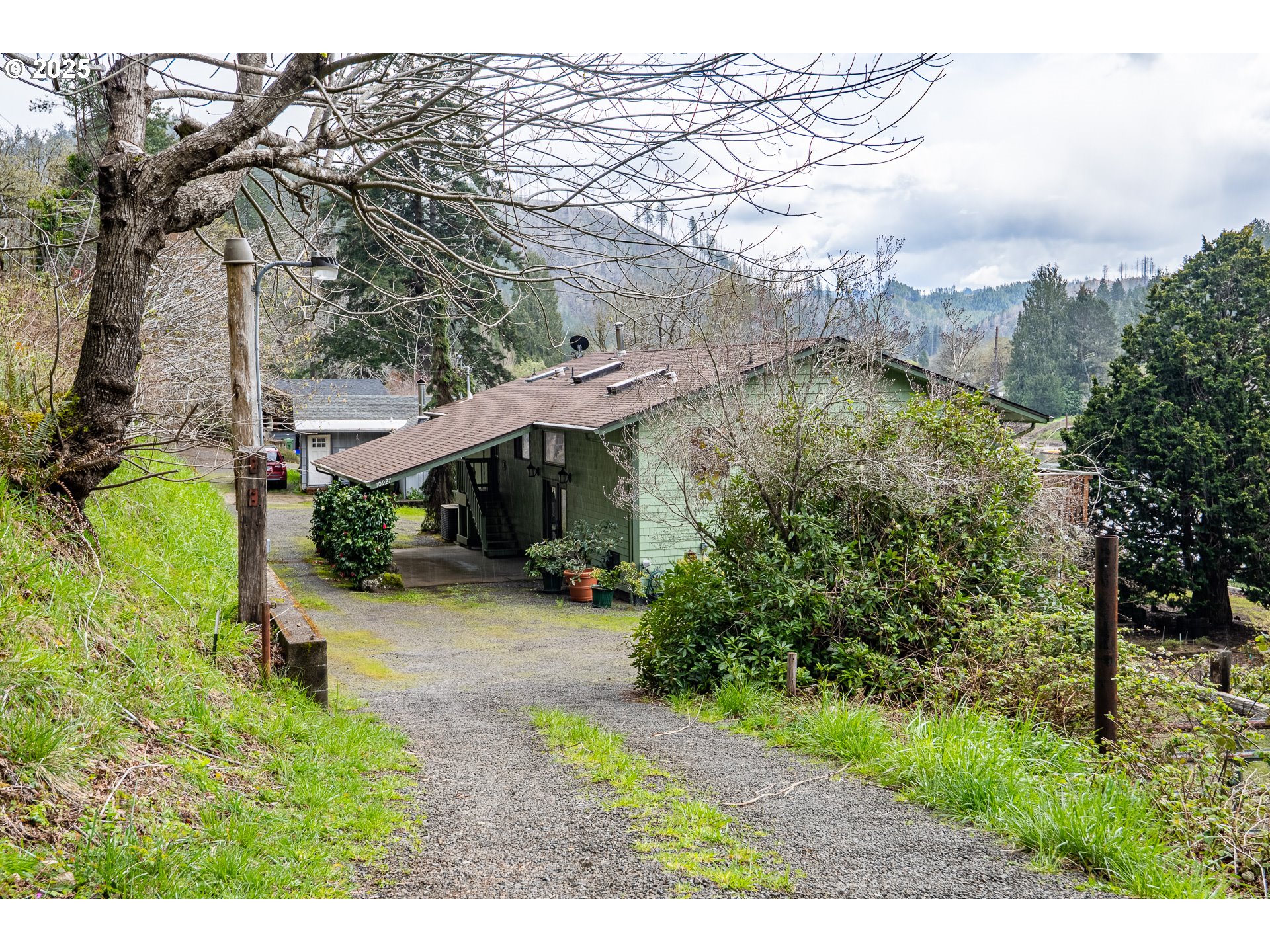 10927 East Mapleton Road Mapleton, OR 97453 - Photo 40 of 47 a view of a house with a yard