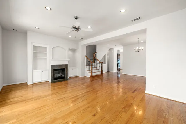 a bathroom with a granite countertop double vanity sink and a mirror