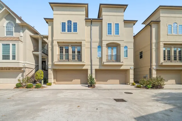 a front view of a brick house many windows