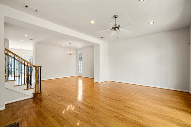 a bathroom with a granite countertop tub shower and mirror