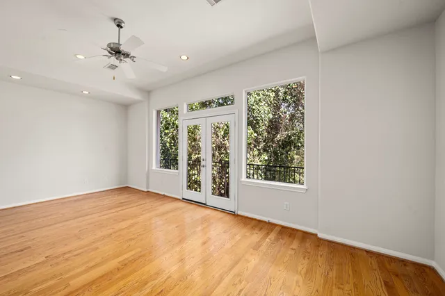 a view of a balcony with wooden stairs