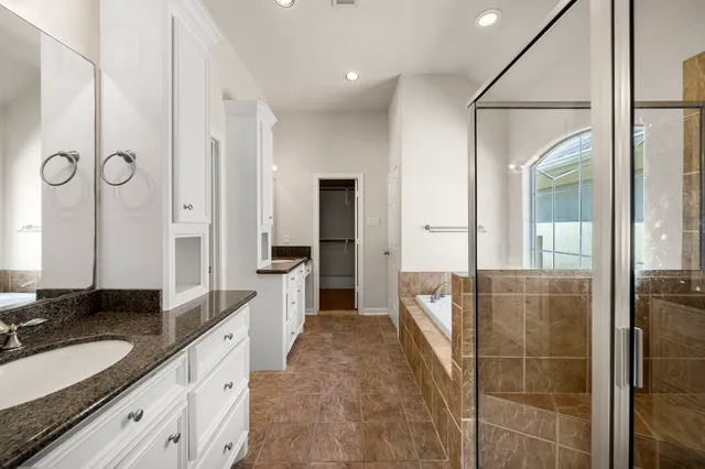 a view of a backyard with wooden fence