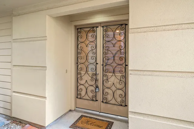 a view of an empty room with glass door