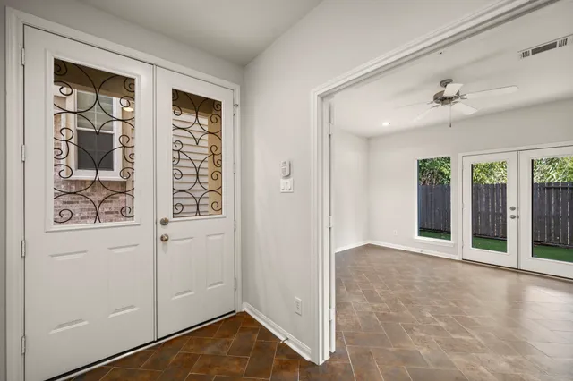 a bathroom with a granite countertop sink a mirror and shower