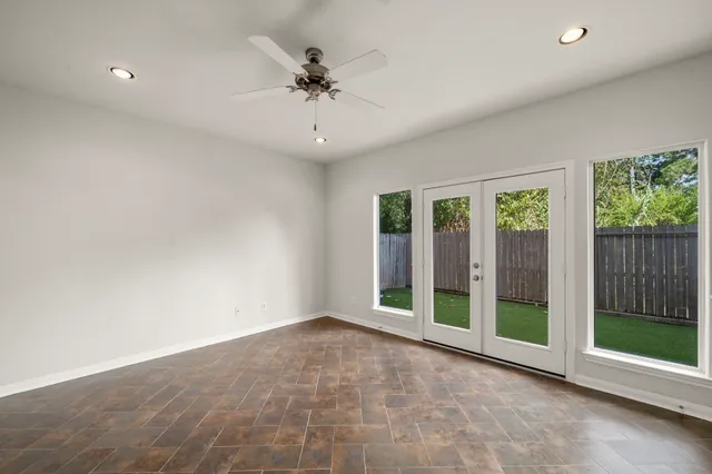 a view of entryway with wooden floor and front door