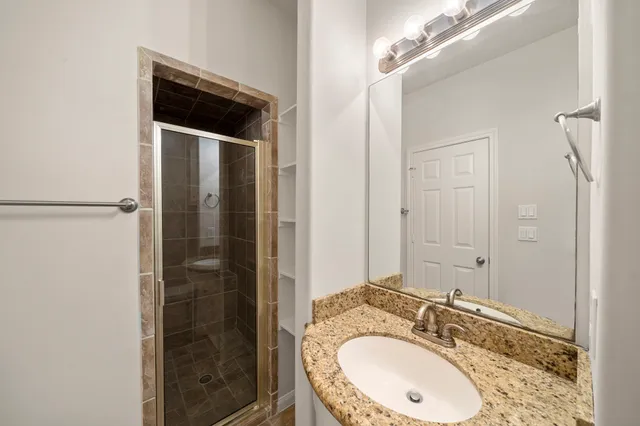 a kitchen with stainless steel appliances granite countertop a stove and a sink